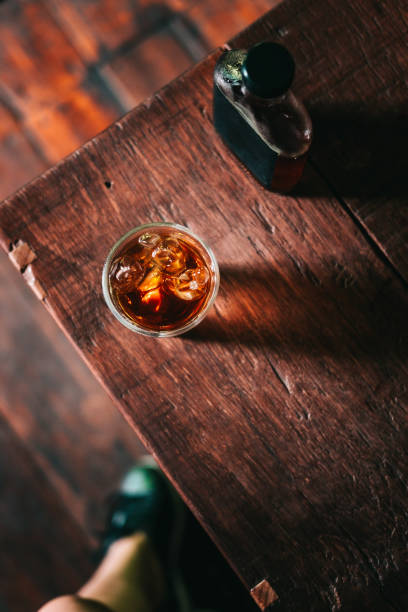 istock Cold brew coffee with ice on wooden table 931544114