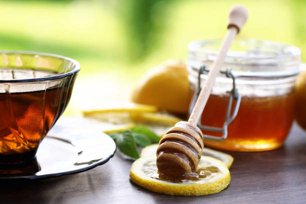 istock Fresh honey with a cup of black tea 931546852