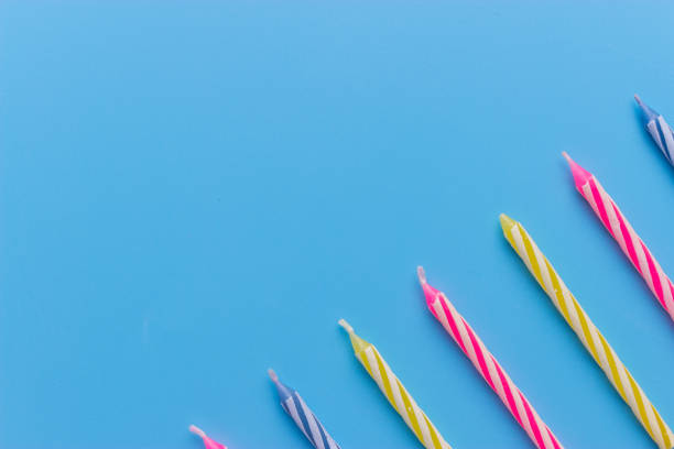 istock Birthday candles on blue background 931547082