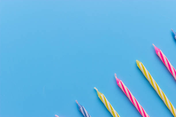 istock Birthday candles on blue background 931547090