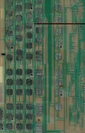 A black printed circuit board with a high technology CPU. The circuit board has a blue backlight. The CPU chip is located in the centre of the image and is surrounded by circuitry and a digital clock.