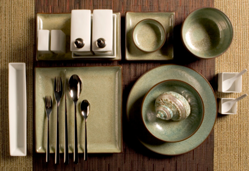 Stainless steel tableware and kitchen utensils placed on the desktop.