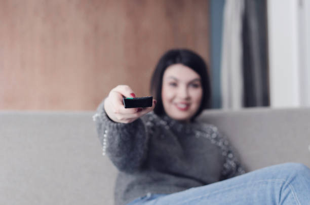 istock woman relaxing in living room 931558564