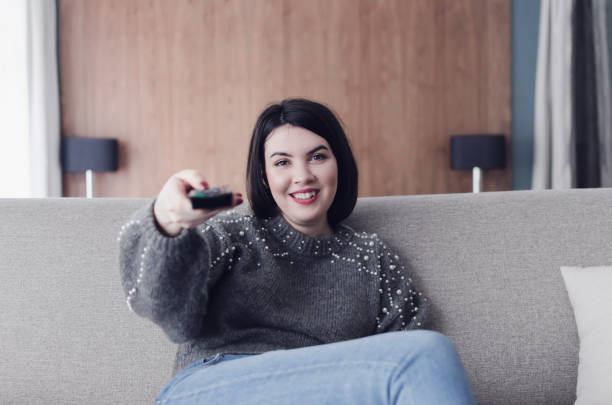 istock Woman watching tv 931558584