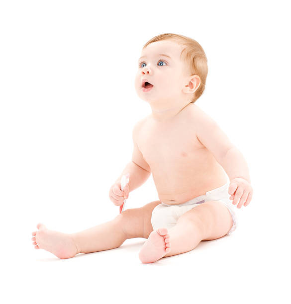 istock baby boy in diaper with toothbrush 93156144