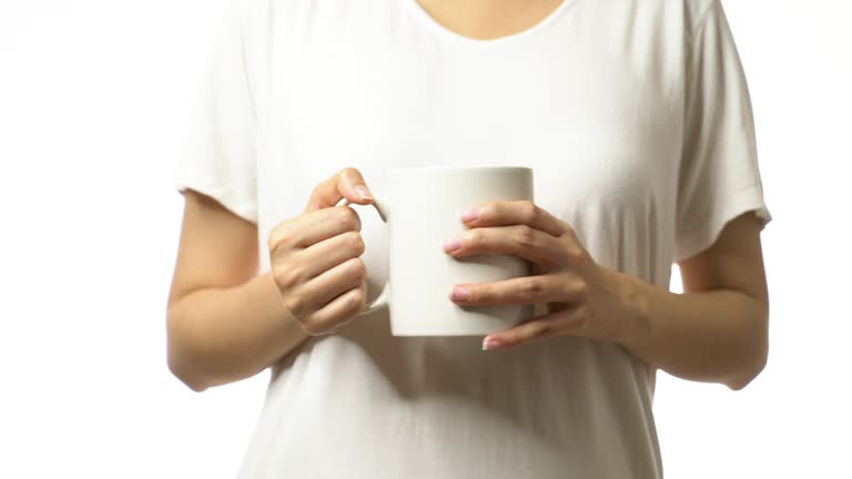 4k footage of woman holding a cup of coffee