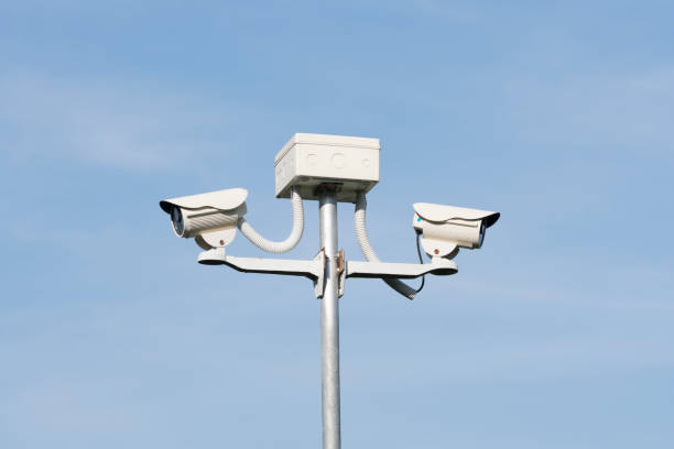 istock cctv security camera on blue background, property protection 931567060
