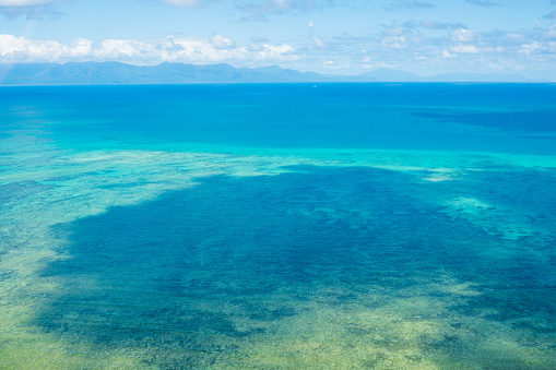 Gorgeous view from above of the Great Barrier Reef in Australia. The Great Barrier Reef is the largest living thing in the world, and considered on of the most amazing wonders of the world!