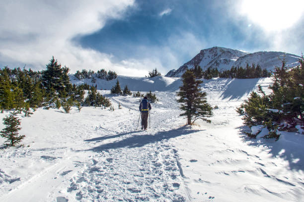 istock Man hiking a snowy mountain in Alaska. 931570834