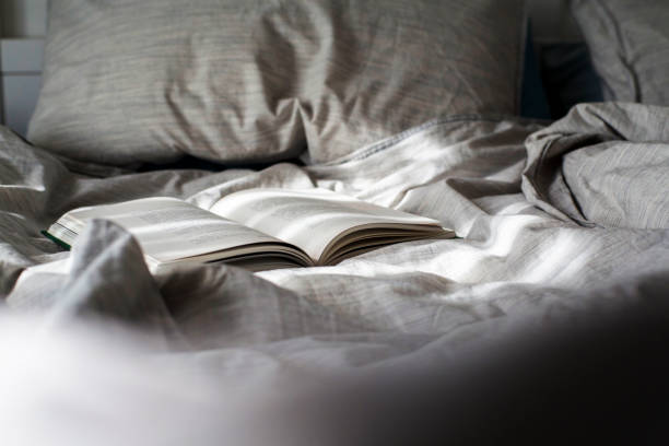 istock book open on bed in the morning sunlight 931579536
