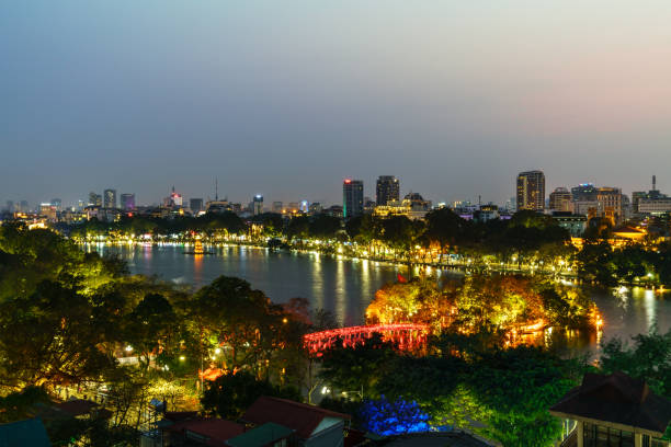 Aerial skyline view of Hoan Kiem lake or Ho Guom, Sword lake. Hoan Kiem is center of Hanoi city. Hanoi cityscape. Aerial skyline view of Hoan Kiem lake or Ho Guom, Sword lake area at twilight. Hoan Kiem is center of Hanoi city. Hanoi cityscape. ho guom stock pictures, royalty-free photos & images