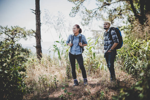istock Couple hiking through forest to the mountaintop. 931583366
