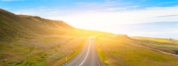 istock Highway through Icelandic landscape under a blue summer sky. 931583676