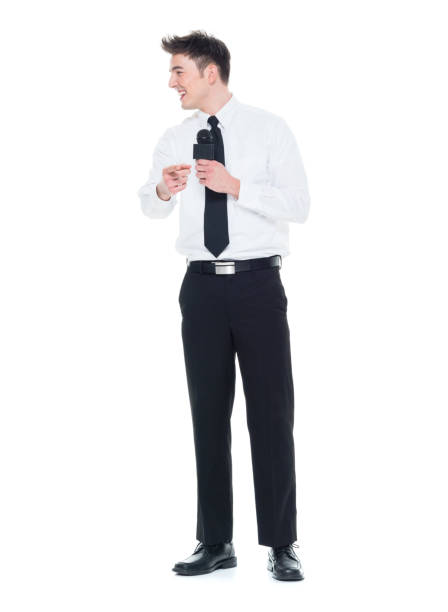 istock Attractive young businessman speaking into a microphone 931592456