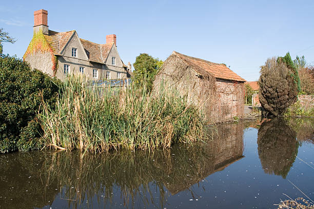 istock English Farm House with Duck Pond 93159312