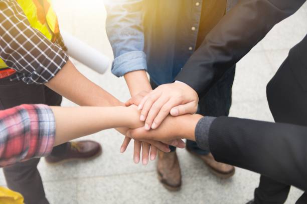 istock Hands put together to show unity and cooperation 931595106
