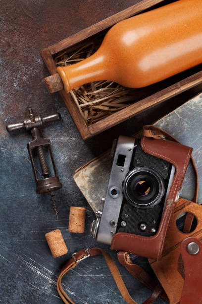 istock Wine bottle in box and vintage camera 931595214