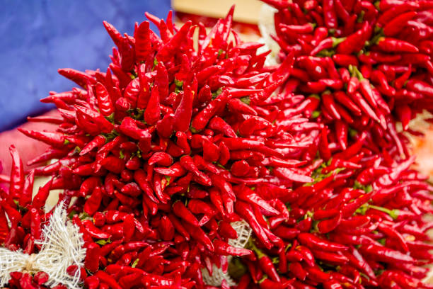 istock Red dried chili peppers in bunches 931595442