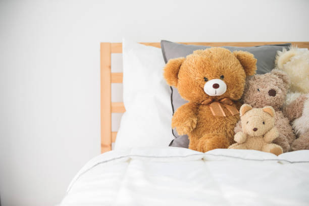 Cute teddy bears in kids white room. stock photo