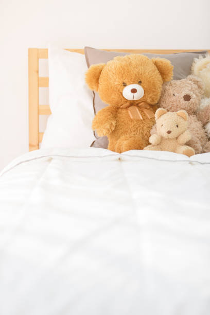 istock Cute teddy bears in kids white room. 931595558