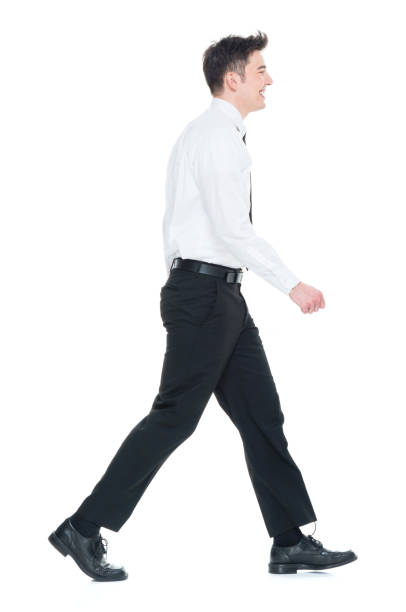 istock Handsome businessman with white shirt walking 931596618