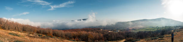 Nature photographer captures clouds over the autumn forest