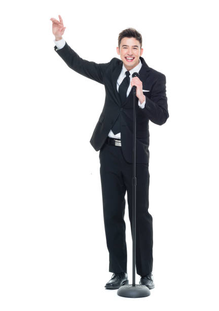 istock Good looking businessman speaking into a microphone and pointing 931597478
