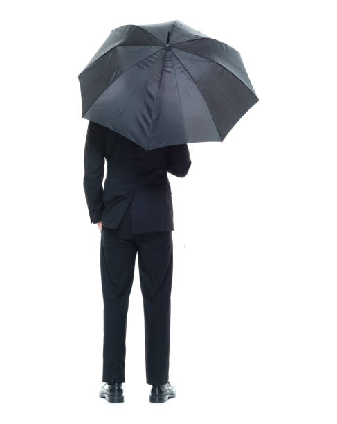 istock Handsome young businessman holding an umbrella 931599602