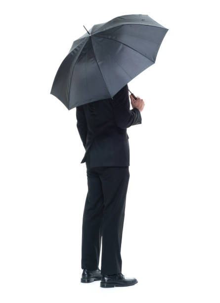 istock Handsome young businessman holding an umbrella 931599604