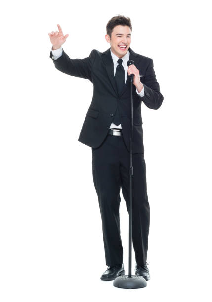 istock Good looking businessman speaking into a microphone and pointing 931599662