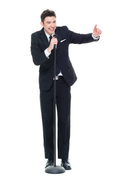 istock Good looking businessman speaking into a microphone 931599728