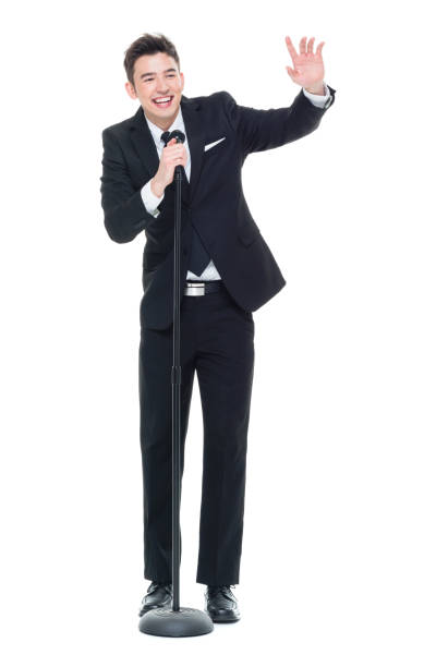 istock Good looking businessman speaking into a microphone 931599884