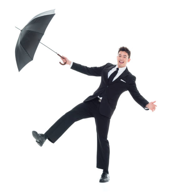 istock Handsome young businessman being silly with an umbrella 931599918