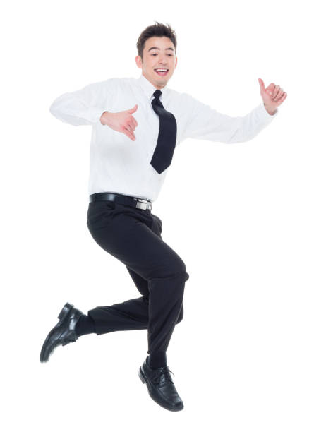 istock Handsome businessman with white shirt jumping 931600240