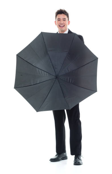 istock Handsome young businessman being silly with an umbrella 931600828