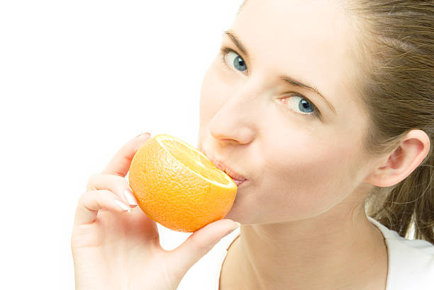 istock young woman with orange 93160123