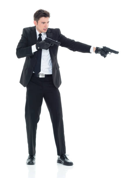 istock Hitman firing two guns 931601434