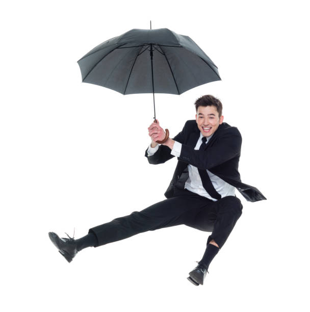 istock Businessman flying with umbrella 931601438