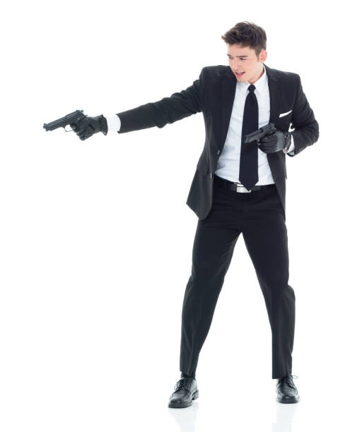 istock Hitman firing two guns 931603682