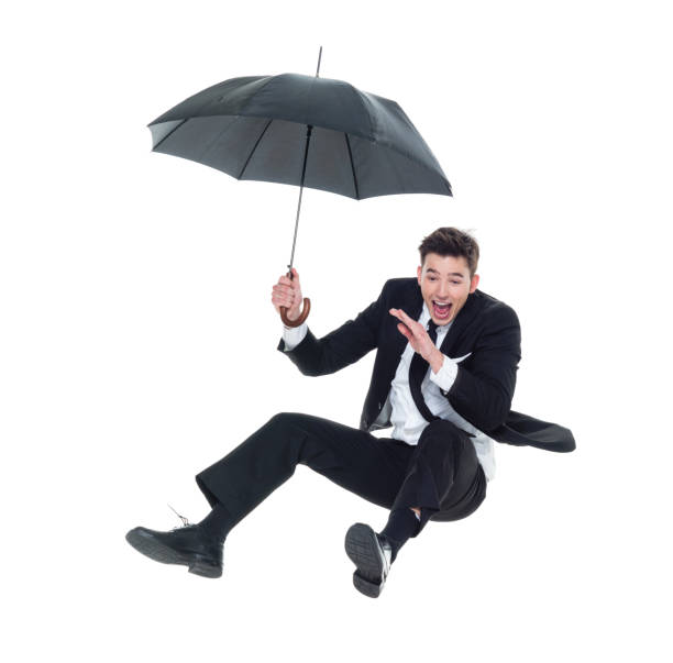 istock Businessman flying with umbrella 931603716
