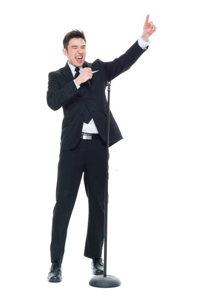 istock Businessman singing into a microphone and pointing 931603724