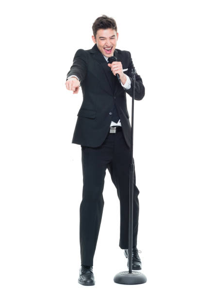 istock Businessman singing into a microphone and pointing 931603994