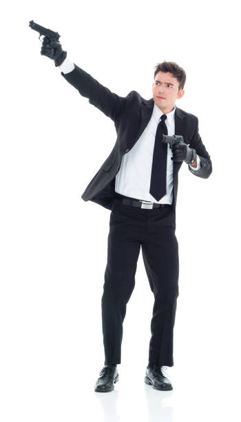 istock Hitman firing two guns 931603996