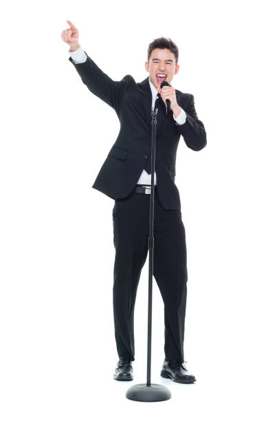 istock Businessman singing into a microphone and pointing 931604322