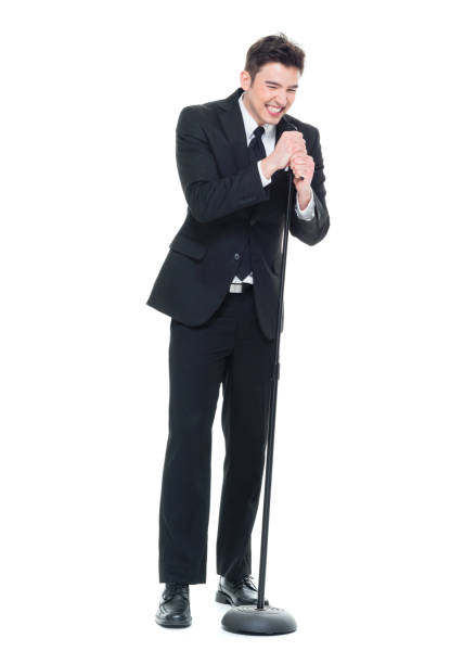 istock Businessman singing into a microphone 931604766