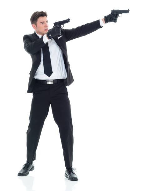 istock Undercover policeman firing two guns 931606626