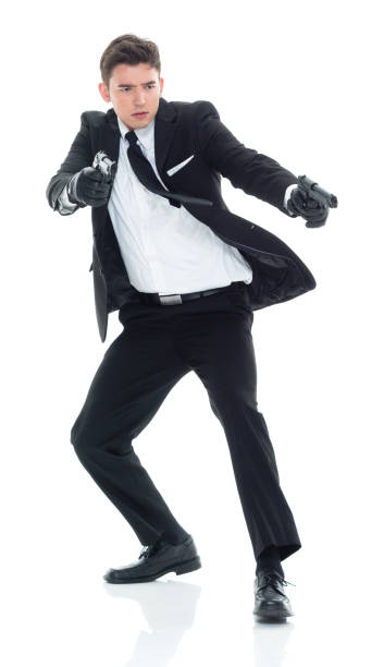 istock Assassin with handgun and firing 931611200
