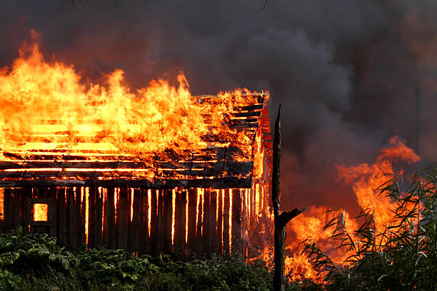 Burning wooden house stock photo