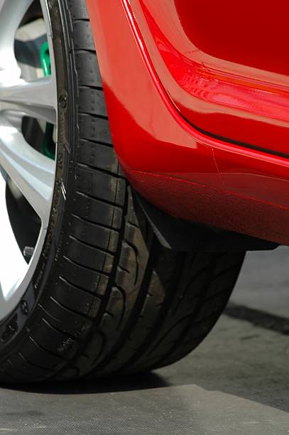 istock black tyre of a red car closeup 93161149