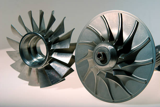 Two precision engineered turbines on a white background stock photo